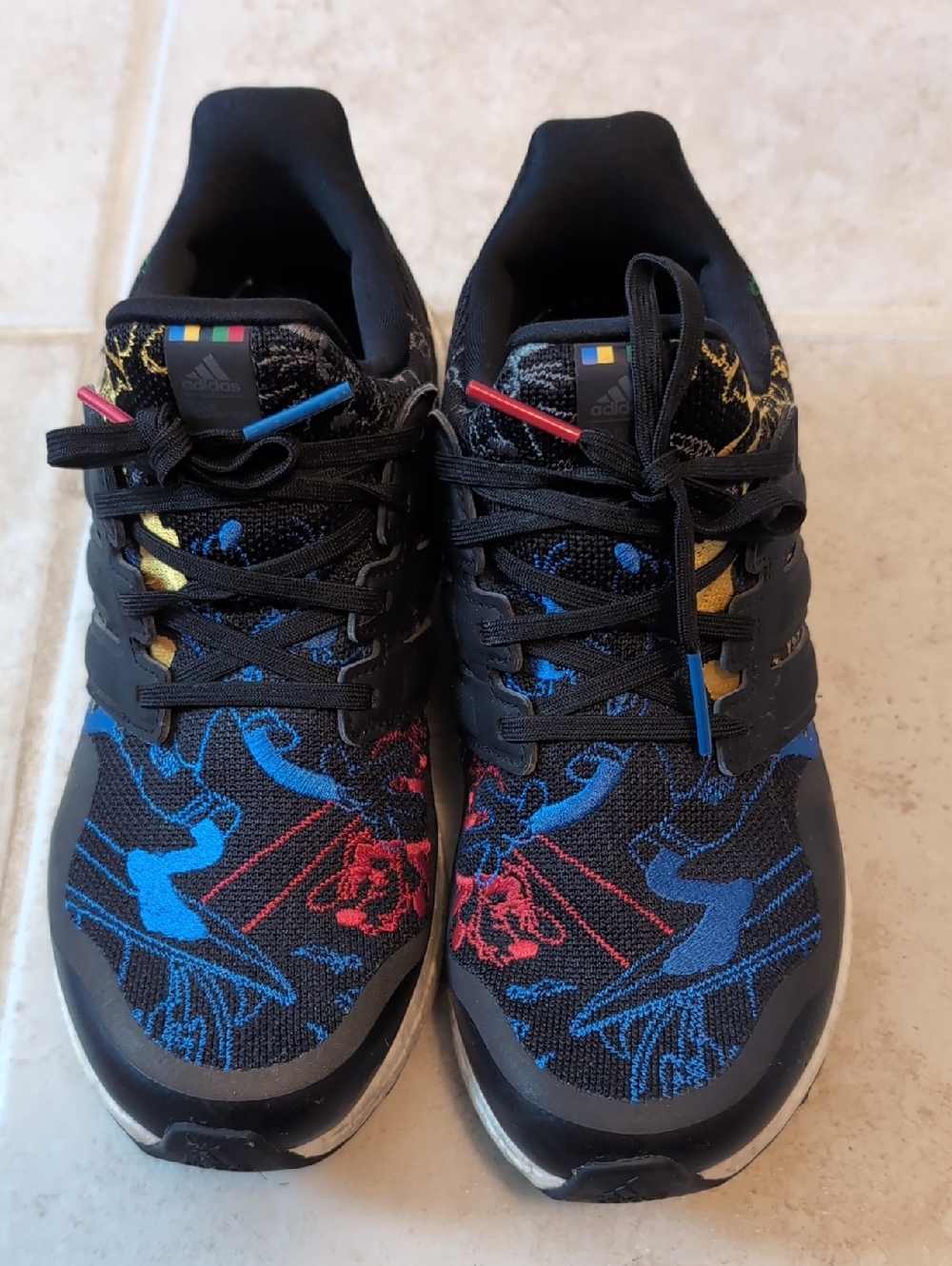 adidas Kids Black Sneakers with Blue Red and Yellow Accents